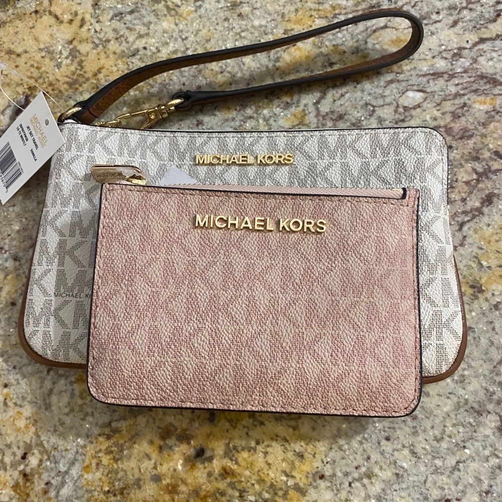 White Michael Kors wristlet and pink coin purse